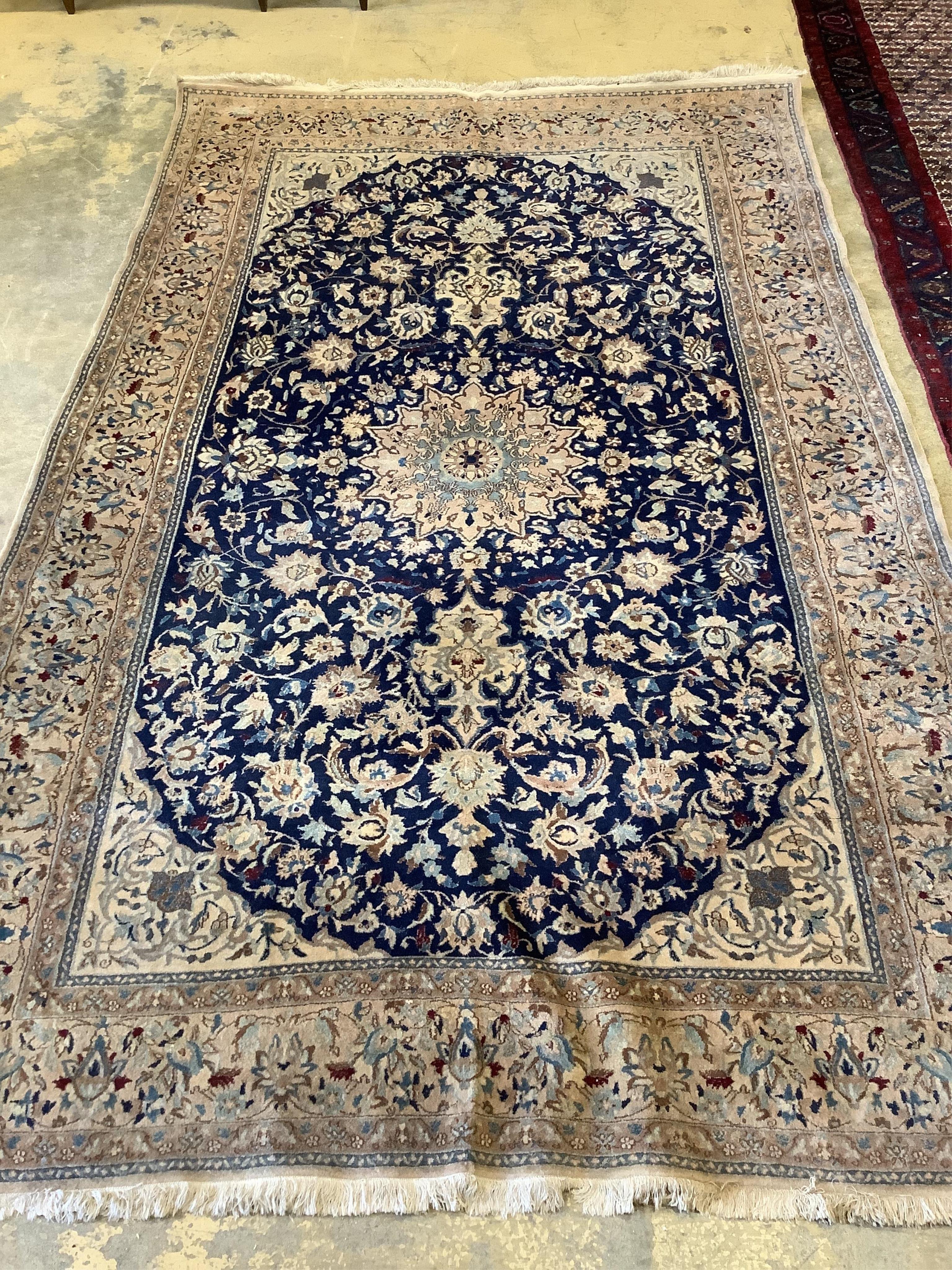 A Nain blue ground carpet, 277 x 174cm. Condition - fair to good